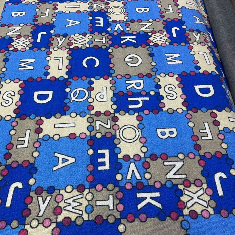 Children's carpet with sky blue letters
