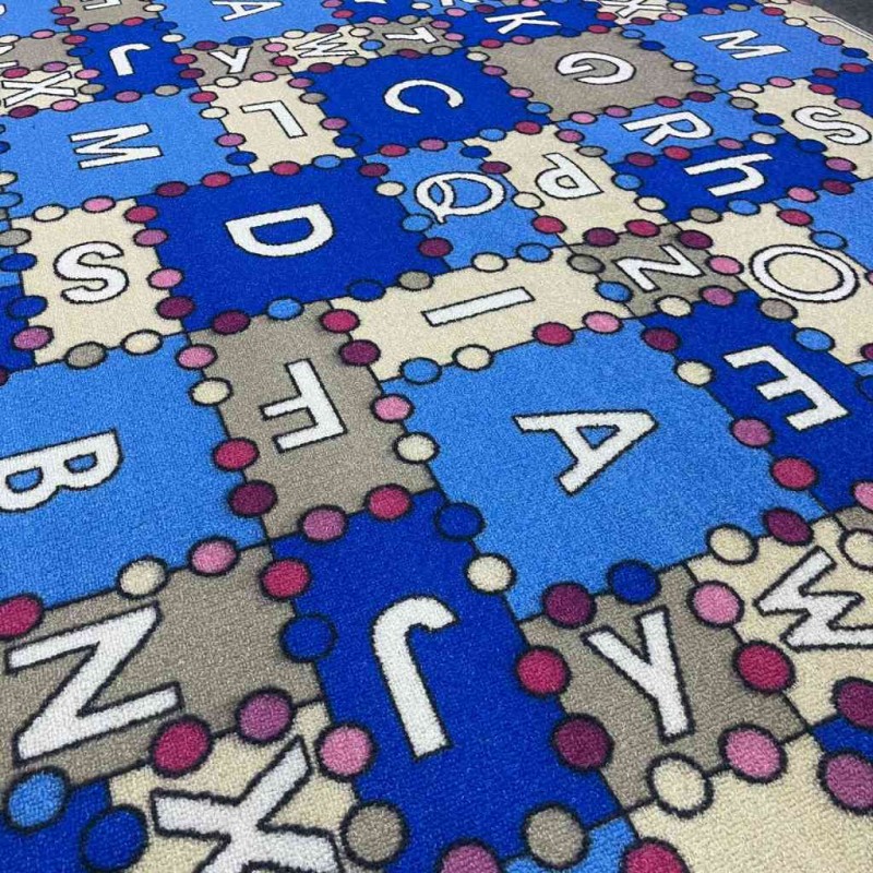 Children's carpet with sky blue letters