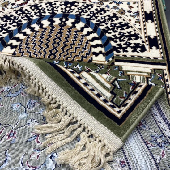 Green prayer rug inspired by the carpet design in Al-Rawdah Al-Nabawi Mosque