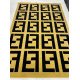 Fendi carpets are golden and black